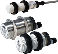 Carlo Gavazzi. Дистанционный емкостный датчик, M18 x 71.5,DC, с тройной защитой,NPN, 3 - 8 мм (регулируемая) Крепится заподлицо Кабель 2 м